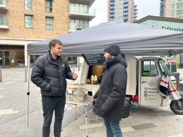 Charlie with Stefano, a trader in Kidbrooke Village